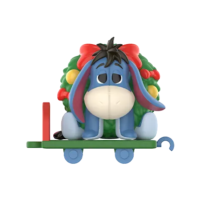 Winnie the Pooh figure with festive bow and garland