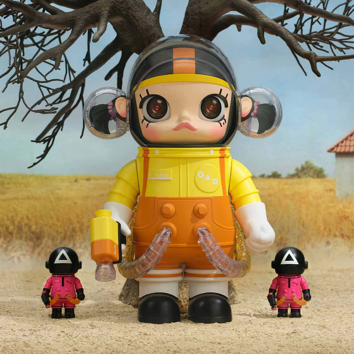 Squid Game SPACE MOLLY Young-hee figure in yellow outfit with masked soldier, desert background display